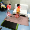 A Video-Based Augmented Reality System for Human-in-the-Loop Muscle Strength Assessment of Juvenile Dermatomyositis